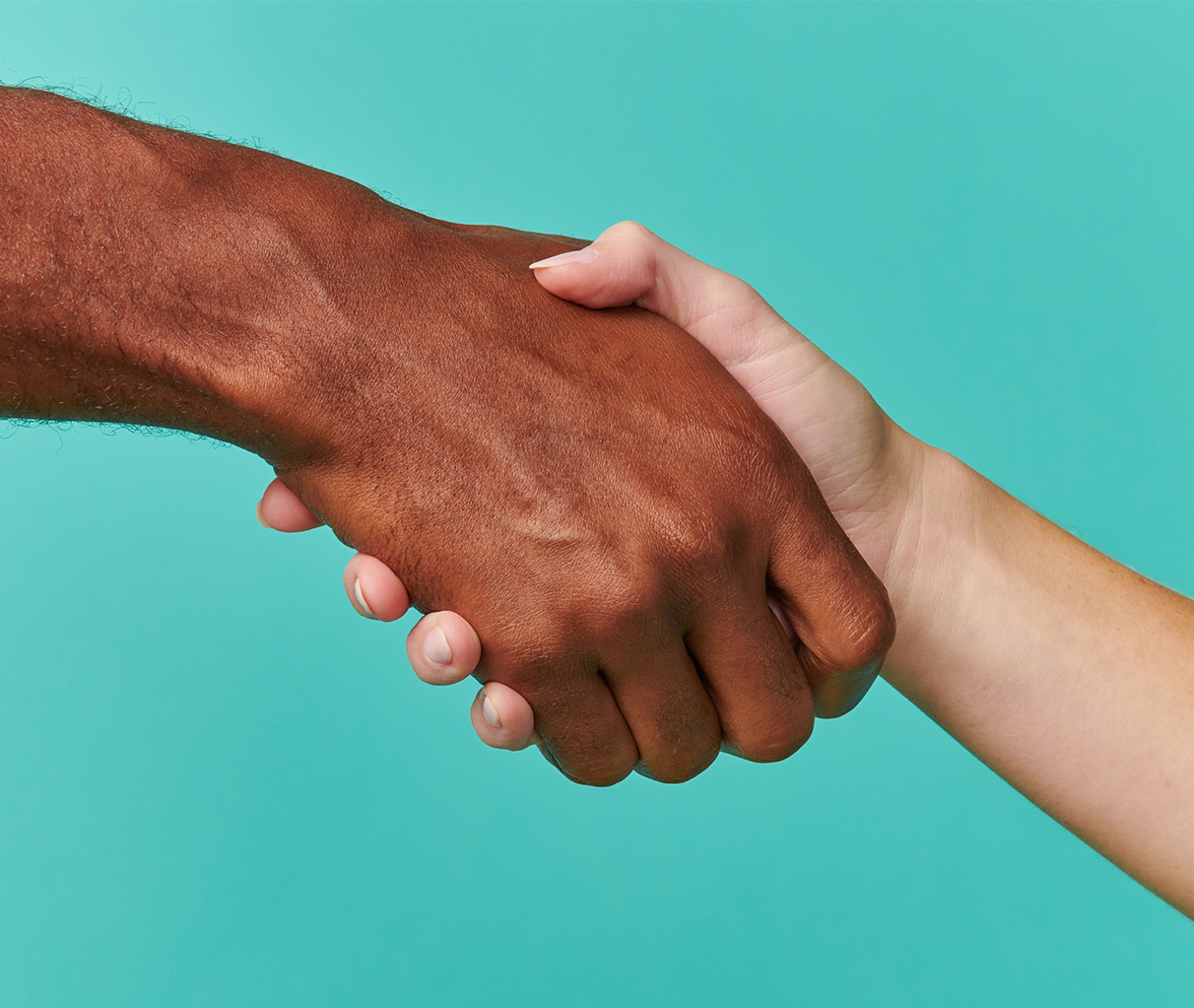 Close-up of a handshake between two people.