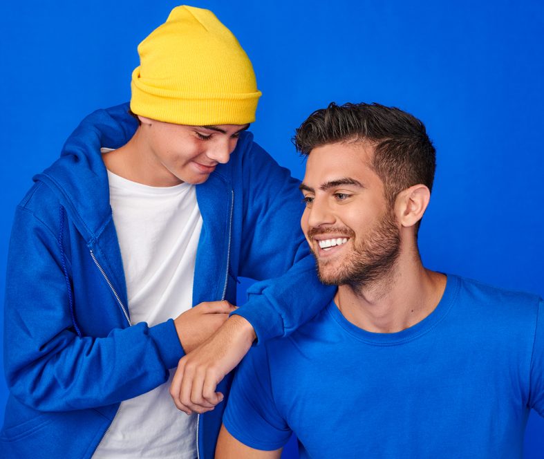 This image shows two men talking and sharing happy moment