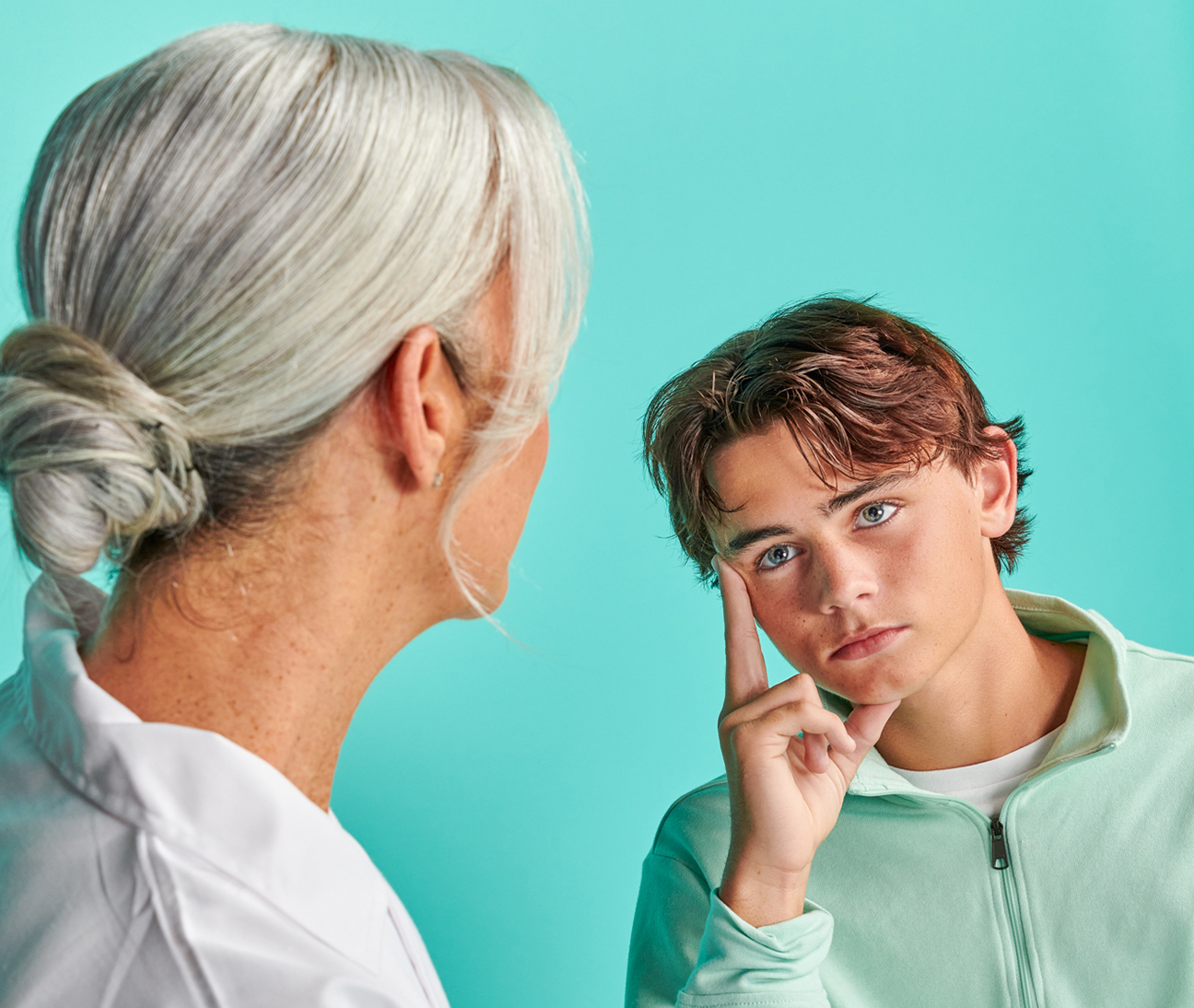 Woman mental health professional providing guidance to a young male patient