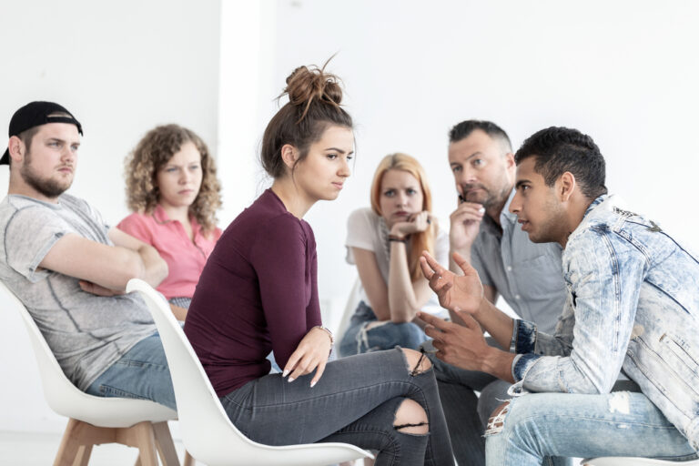 This image shows some people where a boyfriend is talking to his girlfriend